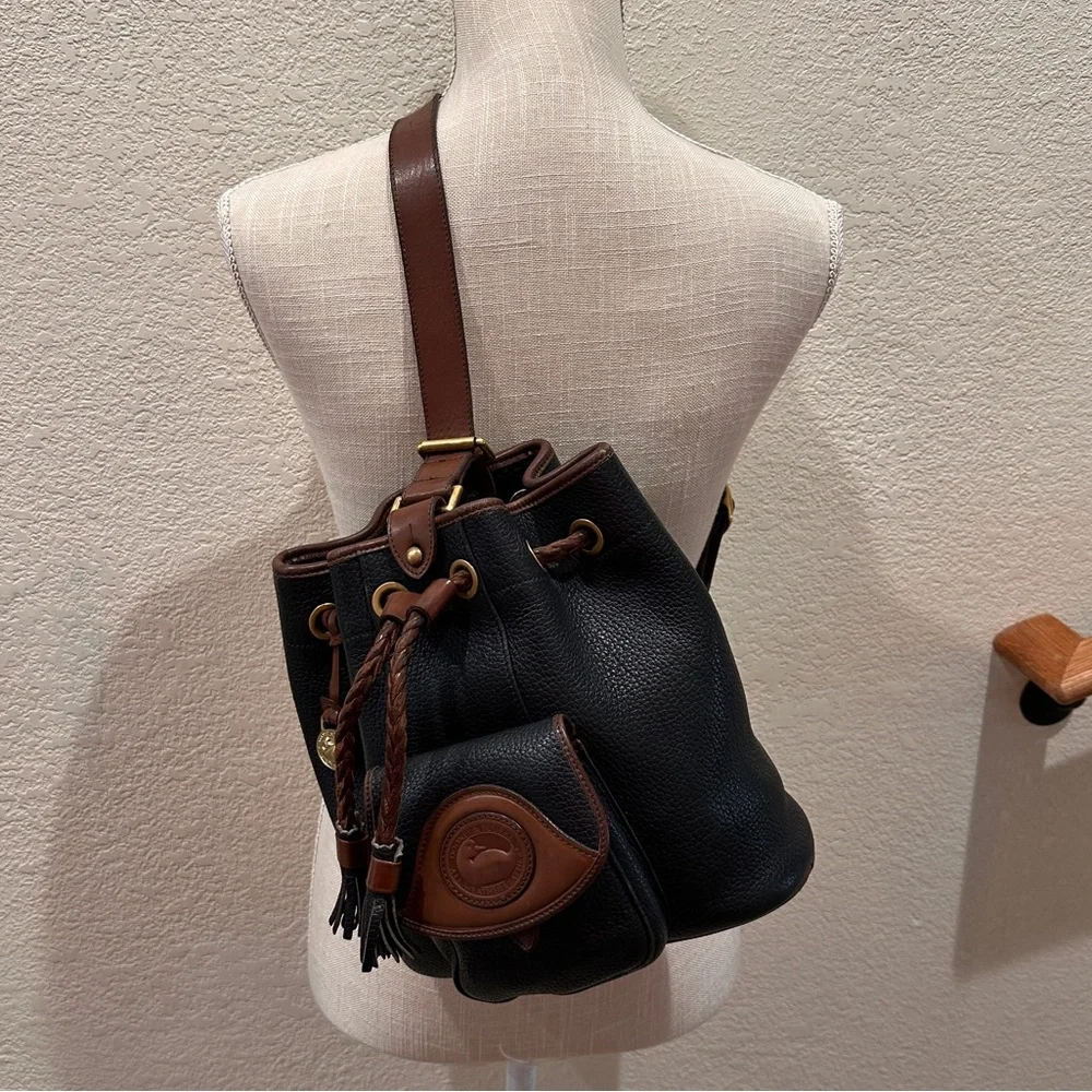 Vintage Dooney & Bourke Black w/Brown All Weather Leather Sling Small Backpack